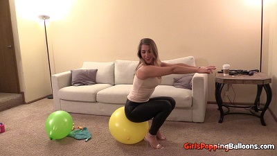 Victoria popping balloons